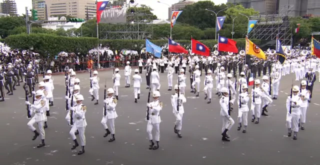 Military contingents marching to formation outside Presidential Office