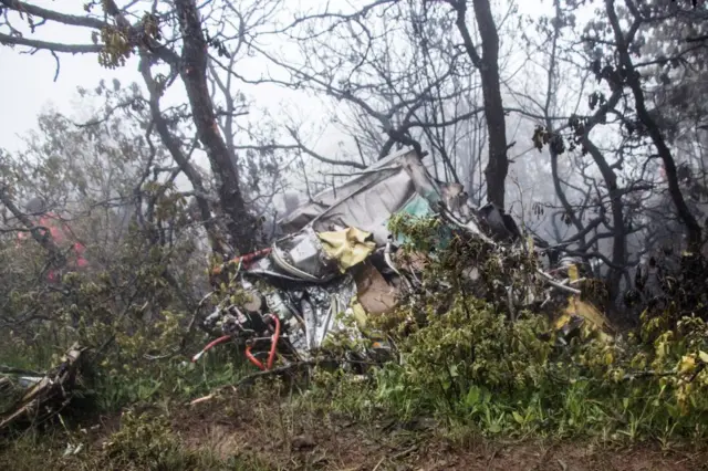 Wreckage, including scraps of metal, of the crashed helicopter on the ground in Varzaqan, Iran.