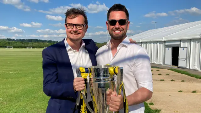 Oxford United Chief exec Tim Williams and manager Des Buckingham with the play-off trophy