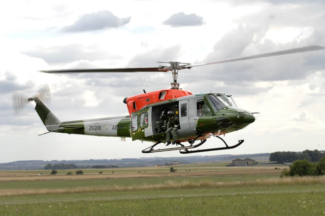 An Army Air Corps [UK / British] Bell 212 helicopter from 671 Squadron at Middle Wallop Aviation Centre, pictured on exercise over Salibury plain