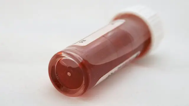 A blood filled vial in a laboratory