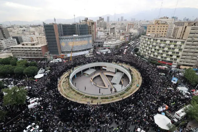 People gather to mourn for the death of the late Iran's President Ebrahim Raisi