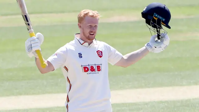 Jordan Cox celebrates scoring a century