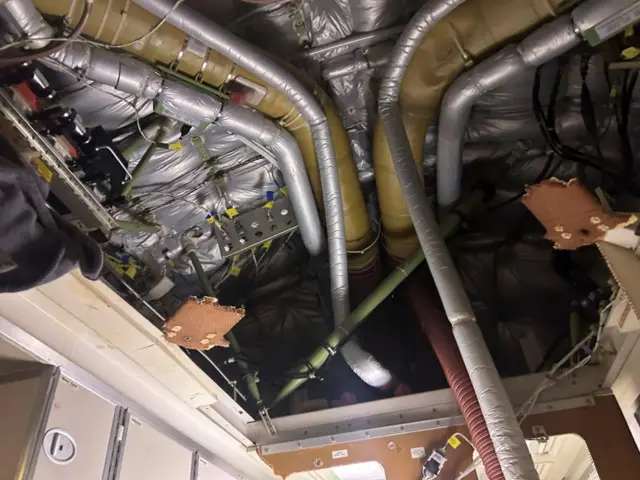 parts of the plane's interior appear to be ripped off the walls.