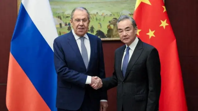 Russian Foreign Minister Sergei Lavrov shaking hand with his Chinese counterpart Wang Yi at the Shanghai Cooperation Organisation (SCO) summit in Astana.