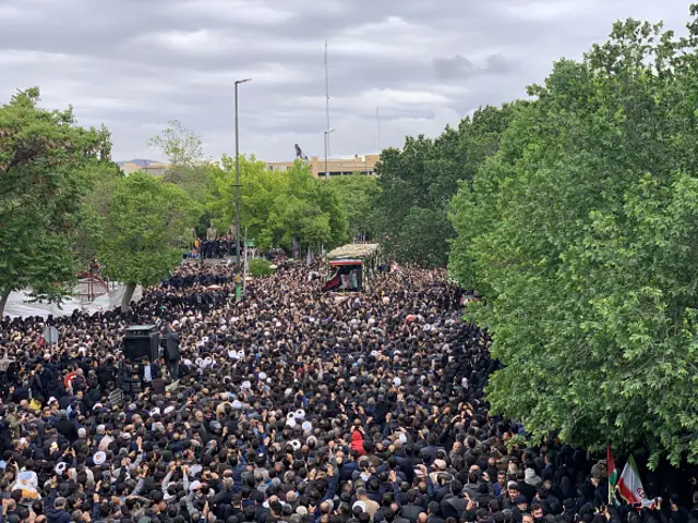 Some Iranian citizens attend a ceremony in Tabriz in memory of late Iranian President Ebrahim Raisi his senior officials who died in a helicopter crash, 21 May 2024