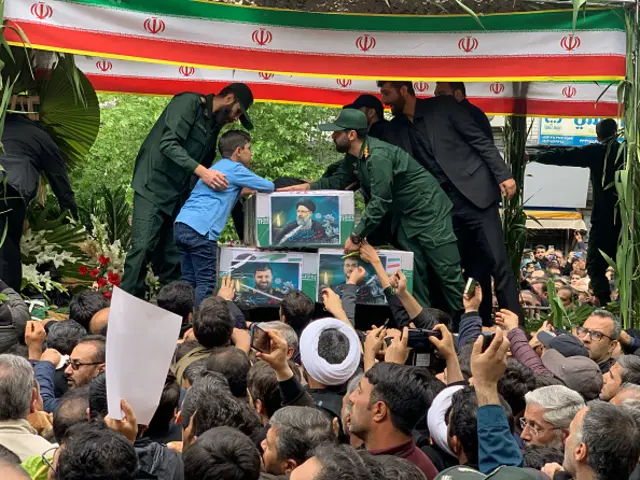 Pictures of Raisi, Abdollahian and other who died in the helicopter crash are seen on their cuffins in the funeral ceremony being held for them in Tabriz, 21 May 2024