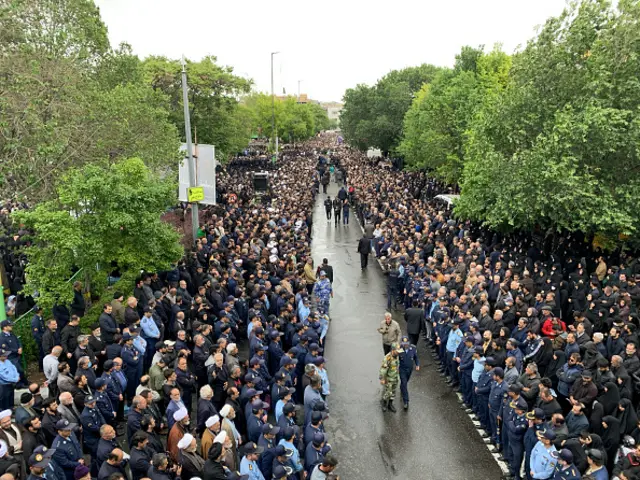 People who are attending the ceremony are opening the way for the caskets, Tabriz, 21 May 2024