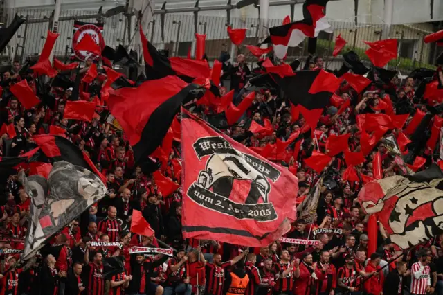 Leverkusen fans wave flags