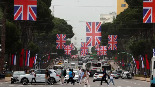 Flags of the United Kingdom hung over a street are pictured a day ahead of the visit of British Foreign Secretary David Cameron in Tirana, Albania, on 21 May