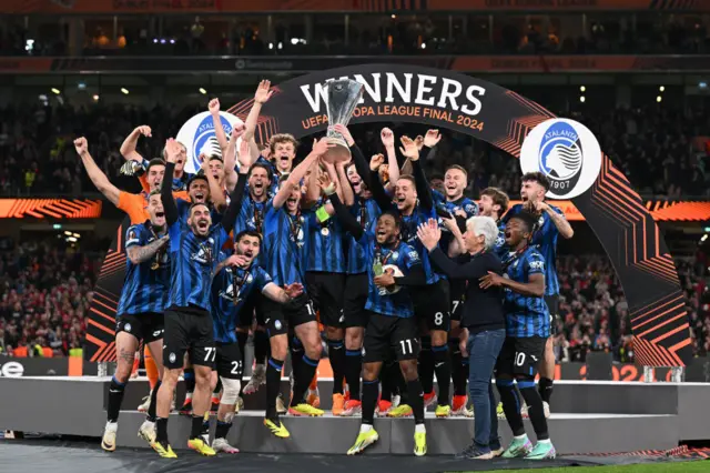 Atalanta lift the Europa League trophy into the air