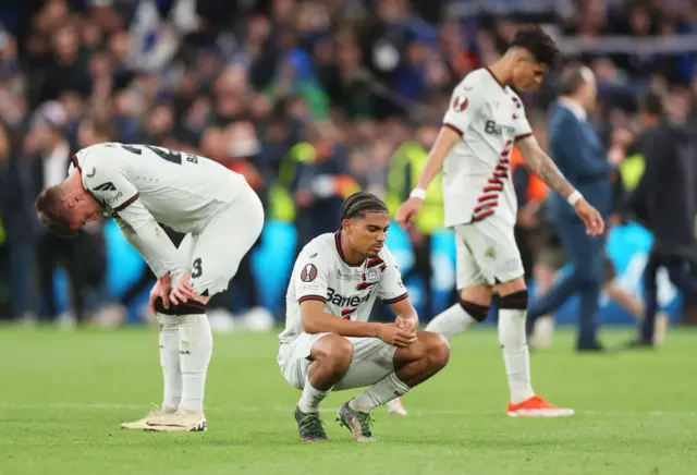 Leverkusen players sink to their knees at full time