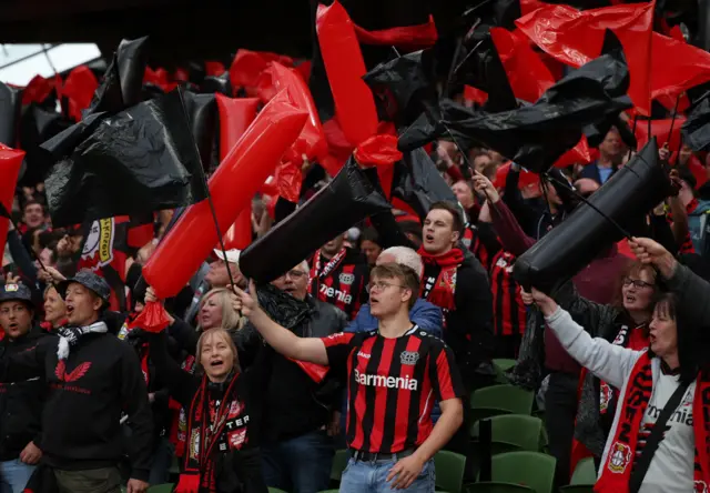 Leverkusen fans wave flags