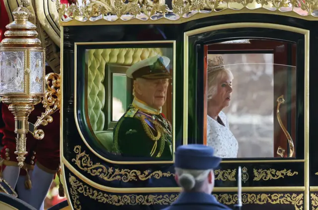 Britain's King Charles III and Queen Camilla travel down the Mall by royal carriage for the State Opening of Parliament in London, Britain, 07 November 2023.