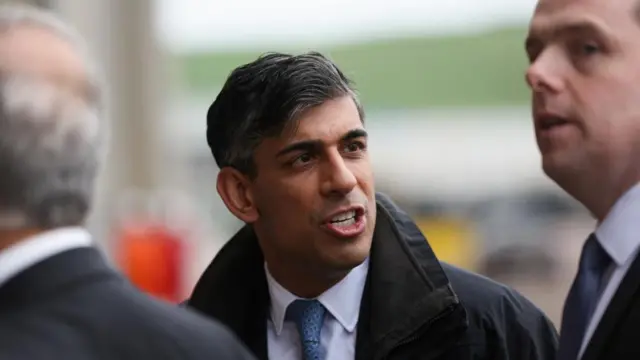 British Prime Minister Rishi Sunak speaks as Scottish Conservative Leader Douglas Ross looks on, after Prime Minister Sunak called for a general election, in Nigg, Scotland, Britain, May 23, 2024