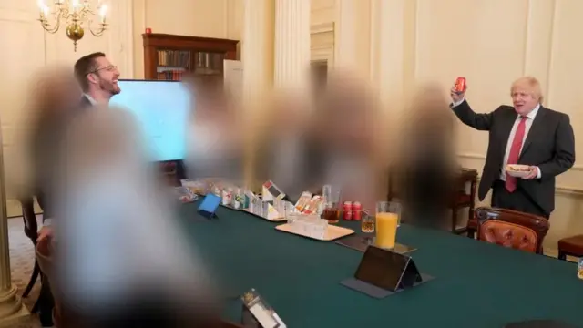 Party in Simon Case's office during partygate, Boris Johnson is pictured rasing a glass alongside Case