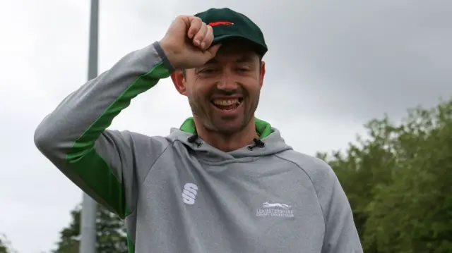 Ian Holland puts on his Leicestershire cap