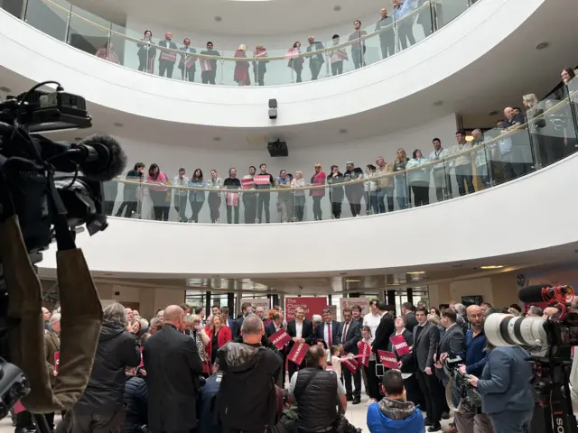 People prepare to hear from Labour leader Sir Keir Starmer