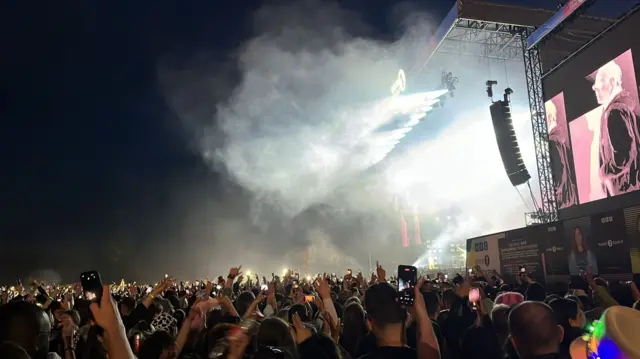 Crowds in the stage light dancing