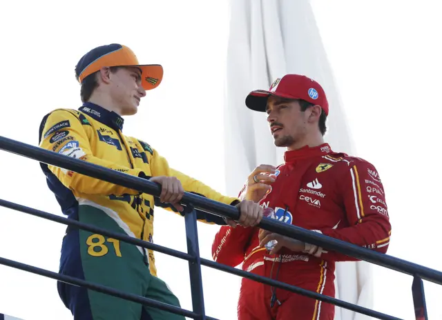 Oscar Piastri and Charles Leclerc chat