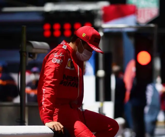 Charles Leclerc looks dejected at the Monaco Grand Prix in 2021