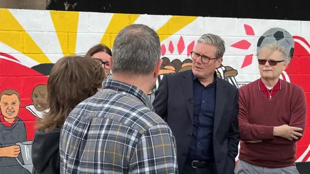 Sir Keir Starmer speaks with voters in Stafford