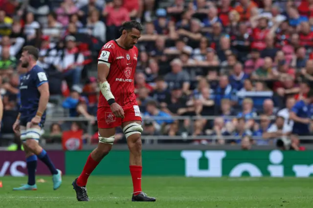 Ritchie Arnold walks from the field after receiving a red a card