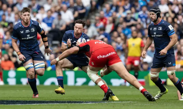 Hugo Keenan is tackled by Emmanuel Meafou