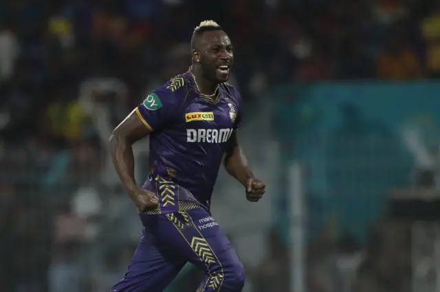 Andre Russell celebrates dismissing Pat Cummins