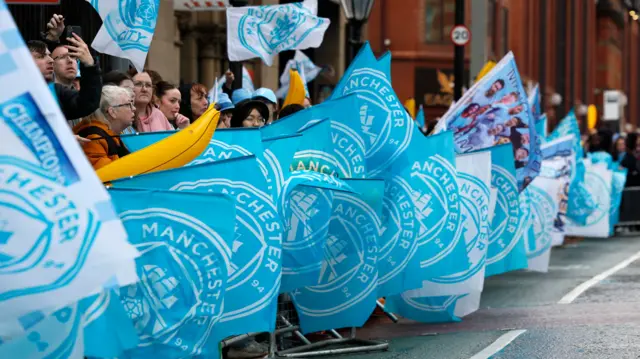 A general view of flags during the trophy parade in Manchester