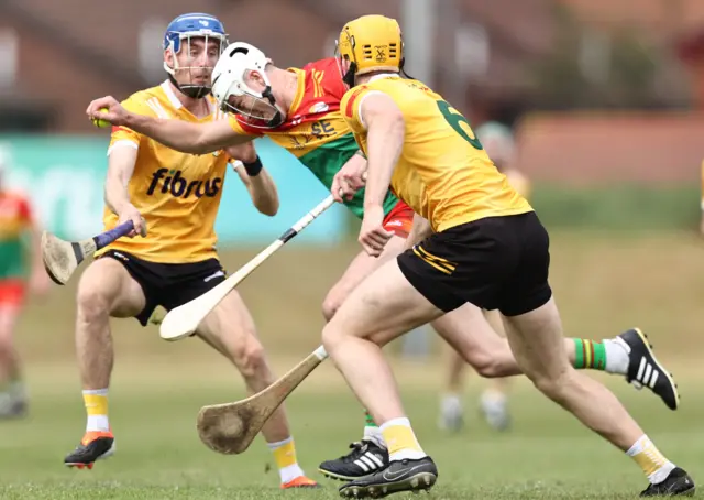 Paddy Boland is challenged by James McNaughton and Niall O'Connor