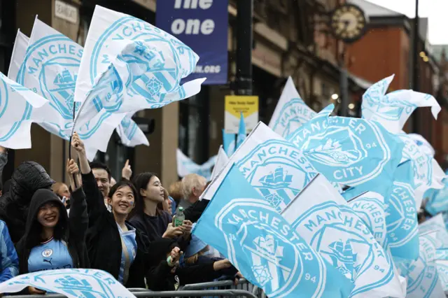 fans wave big flags