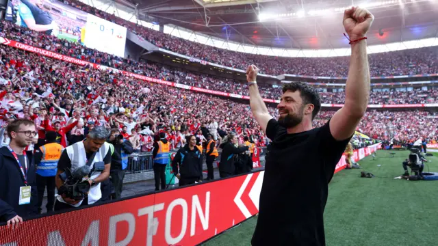 Russell Martin celebrates in front of fans