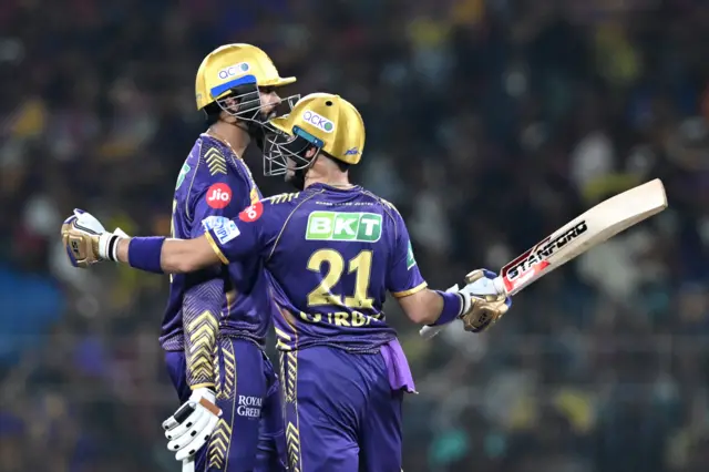 Kolkata Knight Riders' Rahmanullah Gurbaz (R) speaks with his teammate Venkatesh Iyer during the Indian Premier League (IPL) Twenty20 final cricket match between Sunrisers Hyderabad and Kolkata Knight Riders