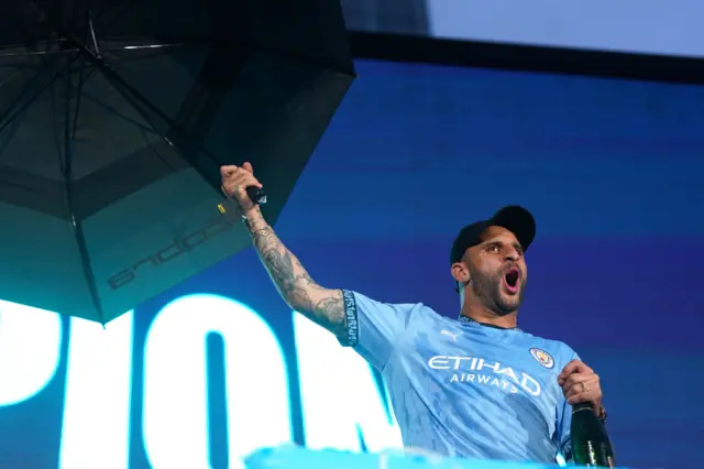 Kyle Walker with umbrella