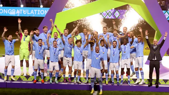 General view as Manchester City's Kyle Walker lifts the trophy alongside teammates after winning the Club World Cup final