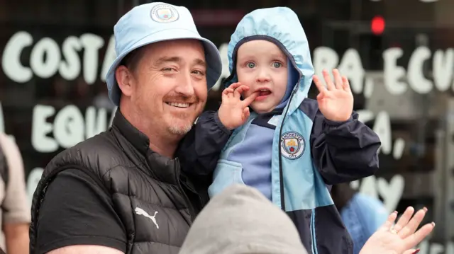 Manchester City fans during a trophy parade in Manchester