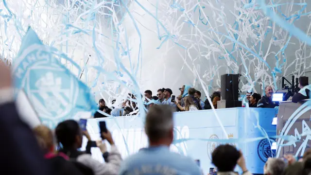 Manchester City's Kyle Walker and Ederson on the bus during the victory parade