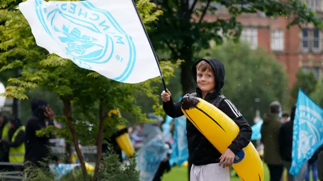 Manchester City fan with flag and blow-up banana