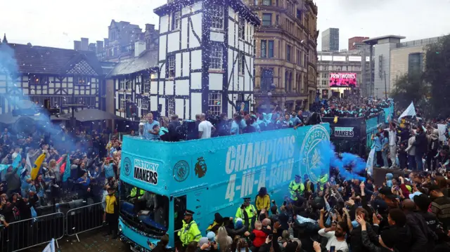 bus with squad through Exchange square