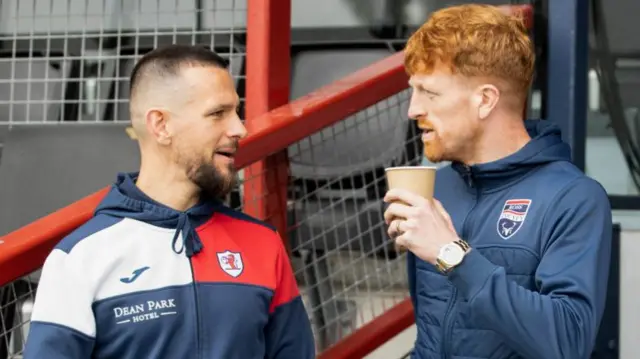 Ross County's Simon Murray speaks with Raith's Dylan Easton