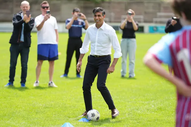 Rishi Sunak plays football with children in Chesham