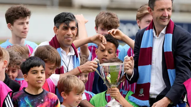 Rishi Sunak meeting children at a football team in Chesham