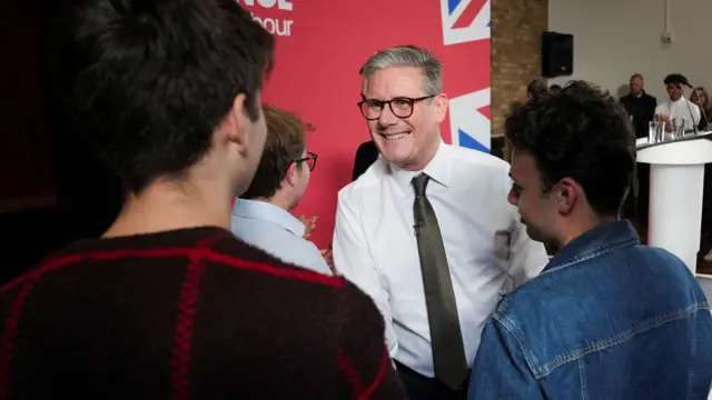 Keir Starmer shakes hands with members of the public after his campaign speech