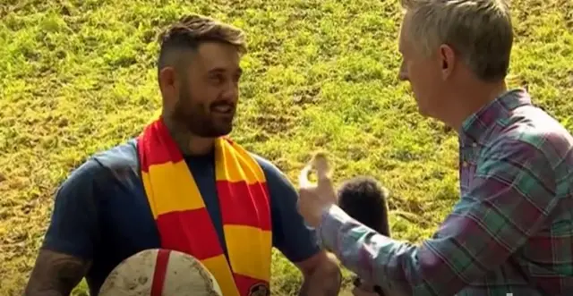 Josh Shepherd talking to TV reporter Steve Knibbs