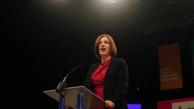 Shadow education secretary Bridget Phillipson behind a podium delivering a speech to party supporters at the Backstage Centre, Purfleet