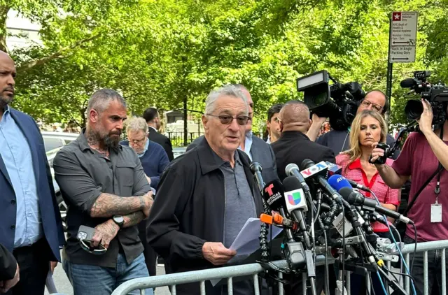 Actor Robert De Niro speaks to the press outside a courthouse in New York