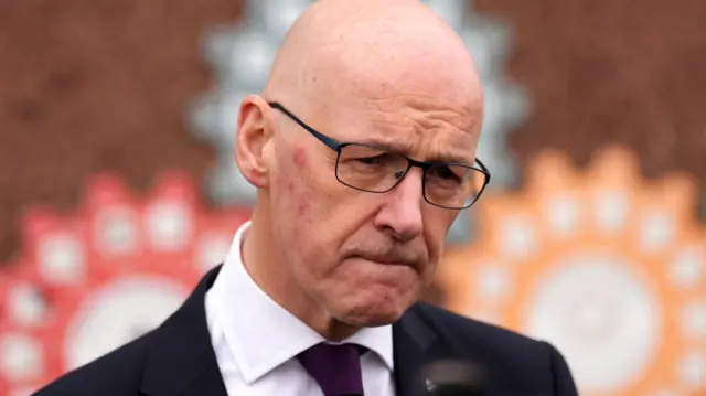 First Minister John Swinney speaks to the media during a visit to a breakfast club at Capshard Primary School in Kirkcaldy, Fife.