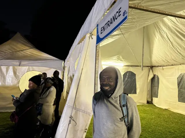 A voter waits to for polling station to open in Johannesburg