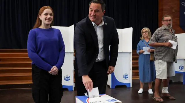 John Steenhuisen, leader of the South African opposition party Democratic Alliance (DA) votes next to his daughter Caroline during the South African elections in Durban, South Africa May 29, 2024